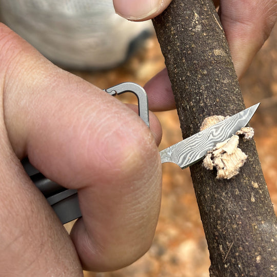 Iron Fist in a Velvet Glove:Titanium Keychain with Whistle, Damascus Knife & Bottle Opener