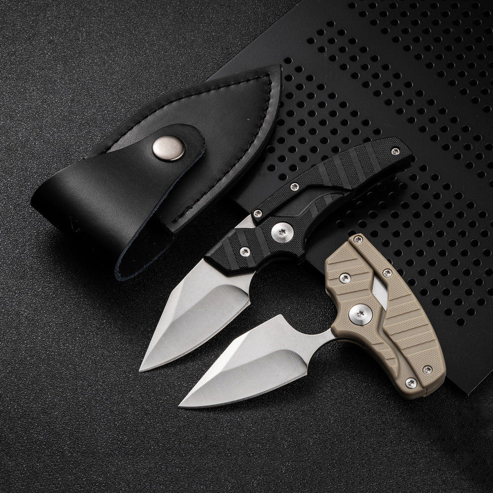 Detail of versatile transformable folding knife shown on black desk